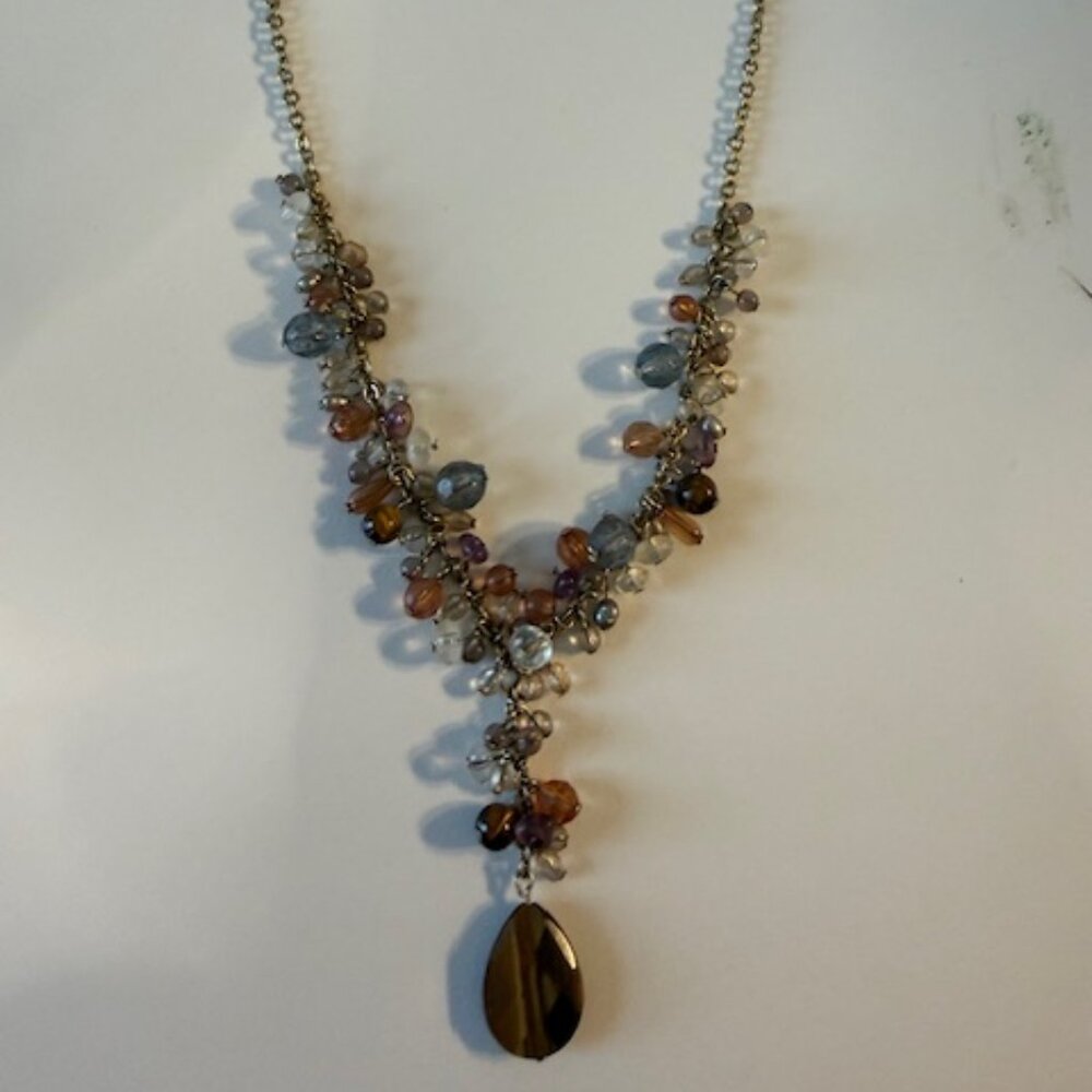 Gold colored costume necklace with pale beads and tiger eye